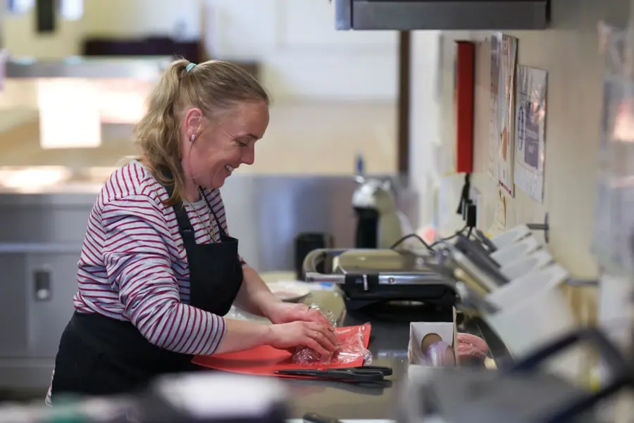 Lady Preparing Food In Kitchen