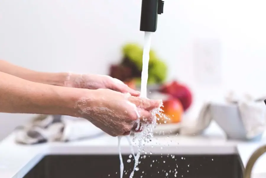 Washing Hands Under Running Tap