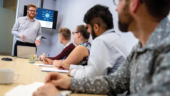 Man Presenting Ideas During A Meeting With Colleagues