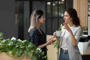 Employees Chat Over Coffee