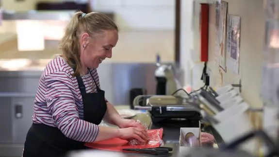 Woman Preparing Food In Kitchen