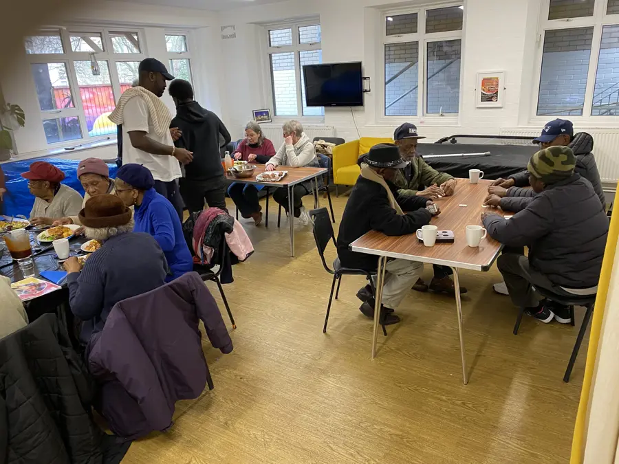 Groups Of People Sat At Tables